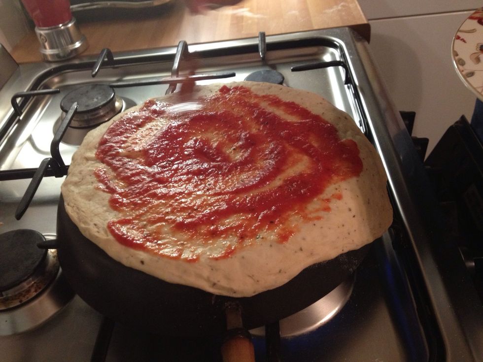 THINLY spread tomato sauce... Too much in centre will create soggy pizza!!