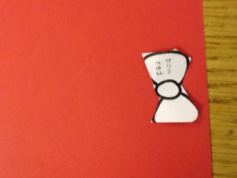 Third cut out the bow and trace it on red  construction paper