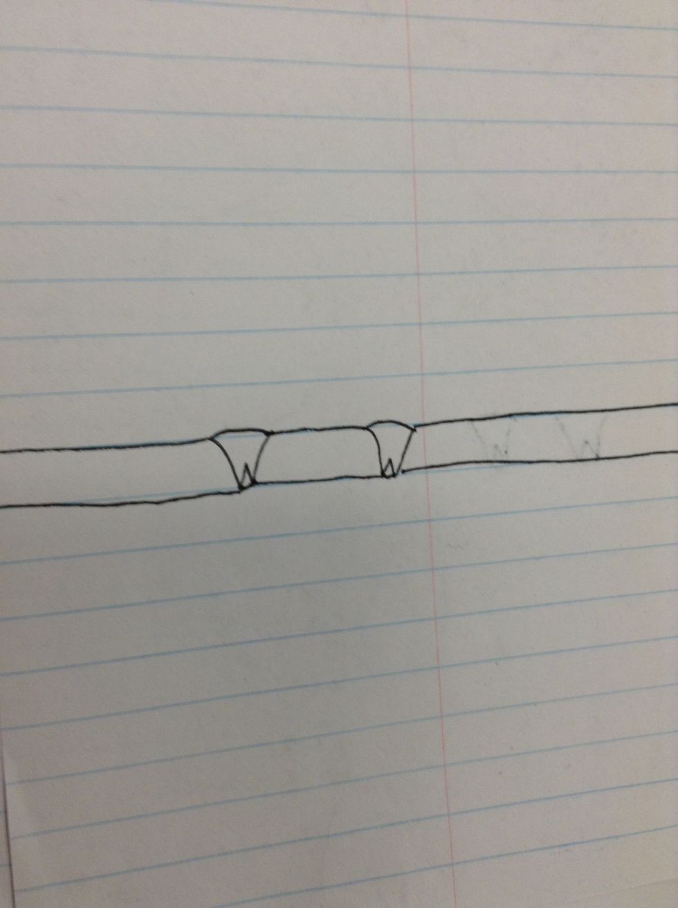 Third, draw two lines that connect to the talons to make the branch that the owl is sitting on.