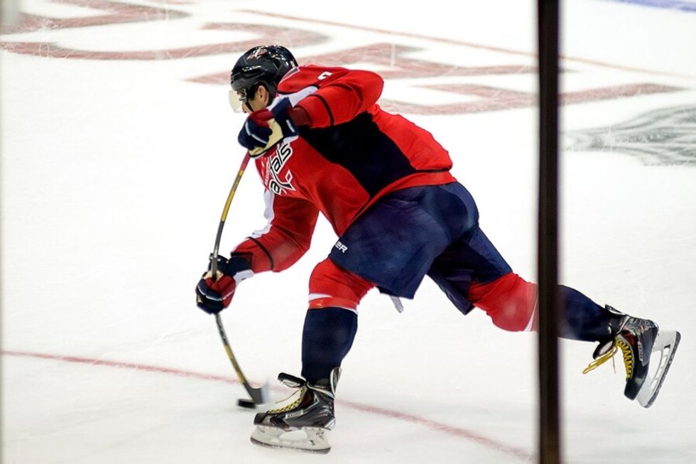 Third step is to hit your stick on the ice right before you hit the puck to get your sick bending