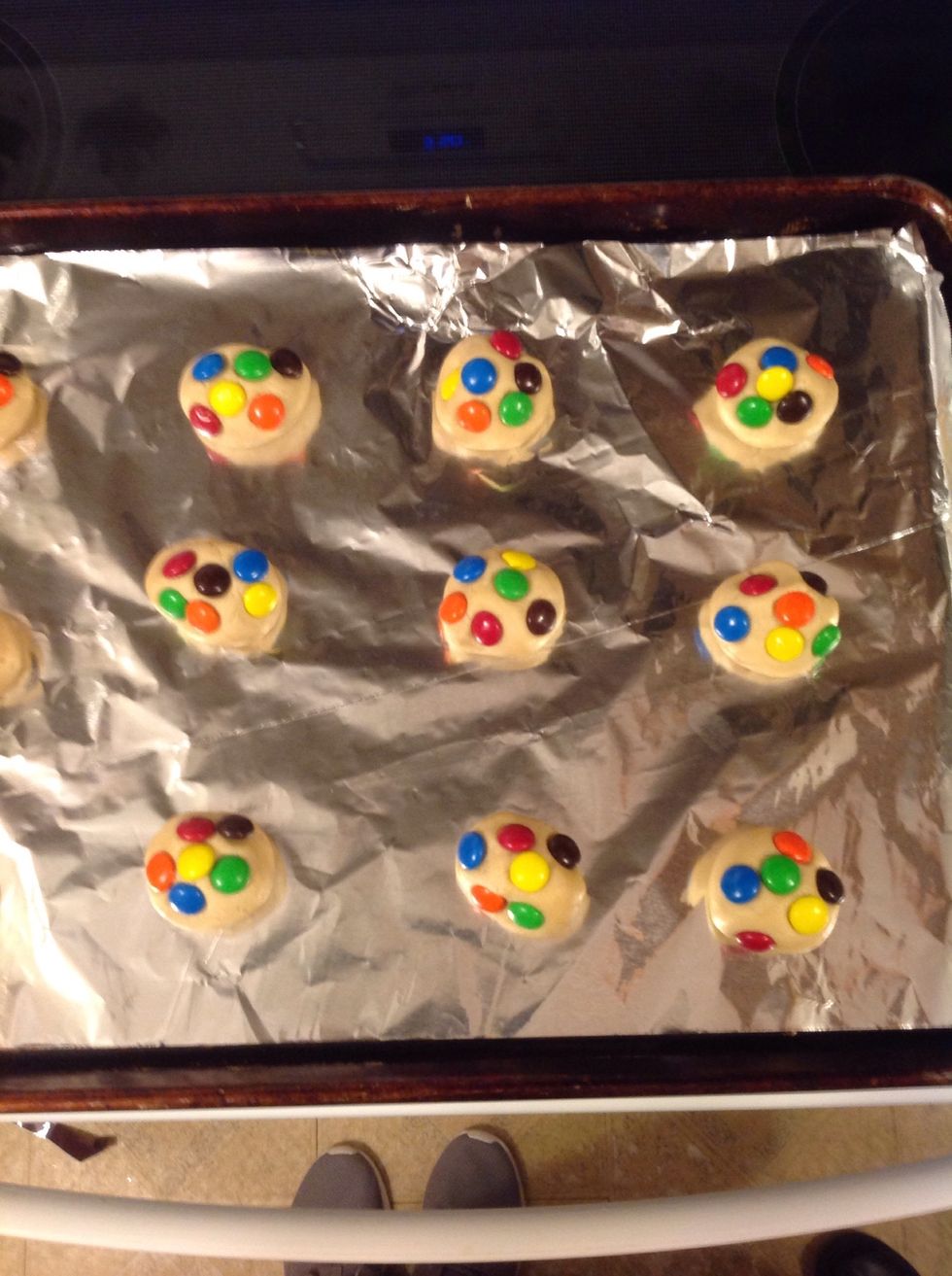 Thirteen: Once done mixing, you will roll them into balls about the size of walnuts and then put M&M's on top.