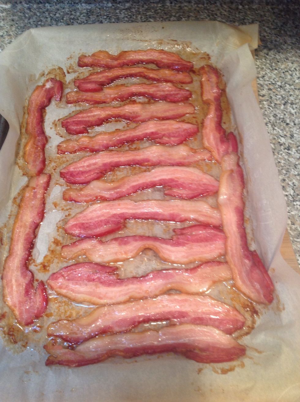 This batch was in for 15 minutes. I put the whole tray on the oven top and the bacon continued to cook and eventually cooled down to a crisp state.