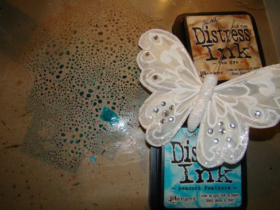 This butterfly I had in my stash, I cut the wings of the body. I swipped the DI in Tea Dye & Peacock Feather and misted water and then pounced my wings on top of the dyes. Allow to dry.