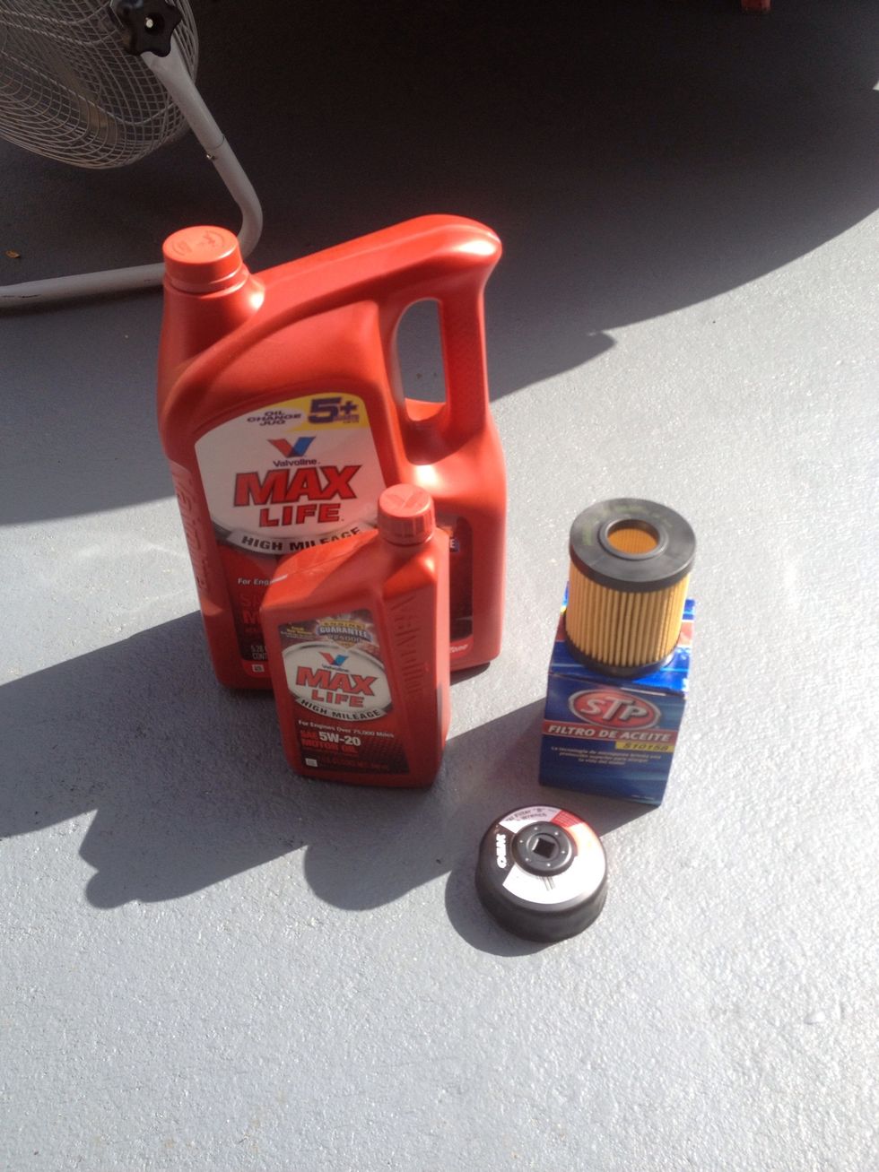 This car takes 6.8 quarts of synthetic oil. This car also takes a filter cartridge that you will need a filter wrench to take off