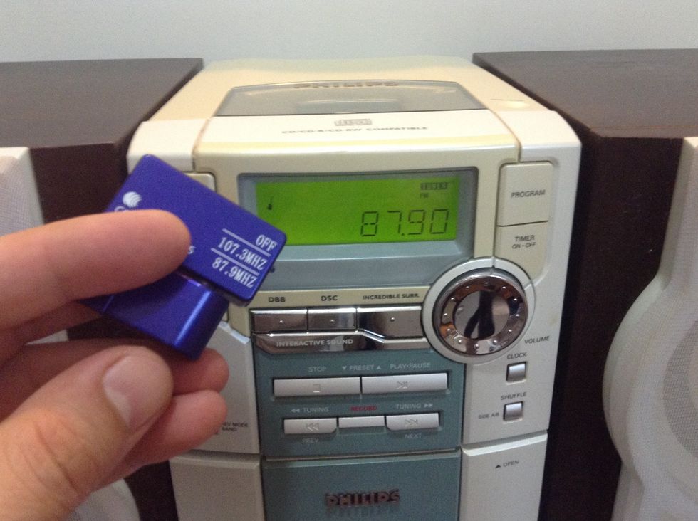 This gadget will allow you to play iPhone music from thru your home stereo without wire.