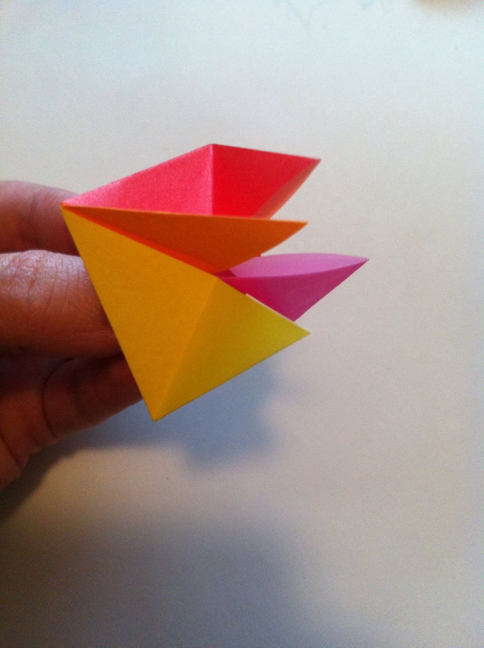 This guy gets tricky to hold. Try to hold same way I do. Now we're going to work on this side. Pay attention to which are pockets & which are tips. Red & yellow = tips; pink & orange = pockets.