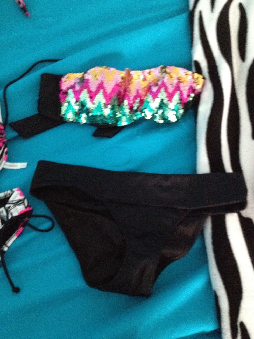 this is a bandeau kind of swim suit! this is personally my favorite because it works with my boobs hahaha!(: but also because the bottom isn't totally covering absolutely everythin but enough!