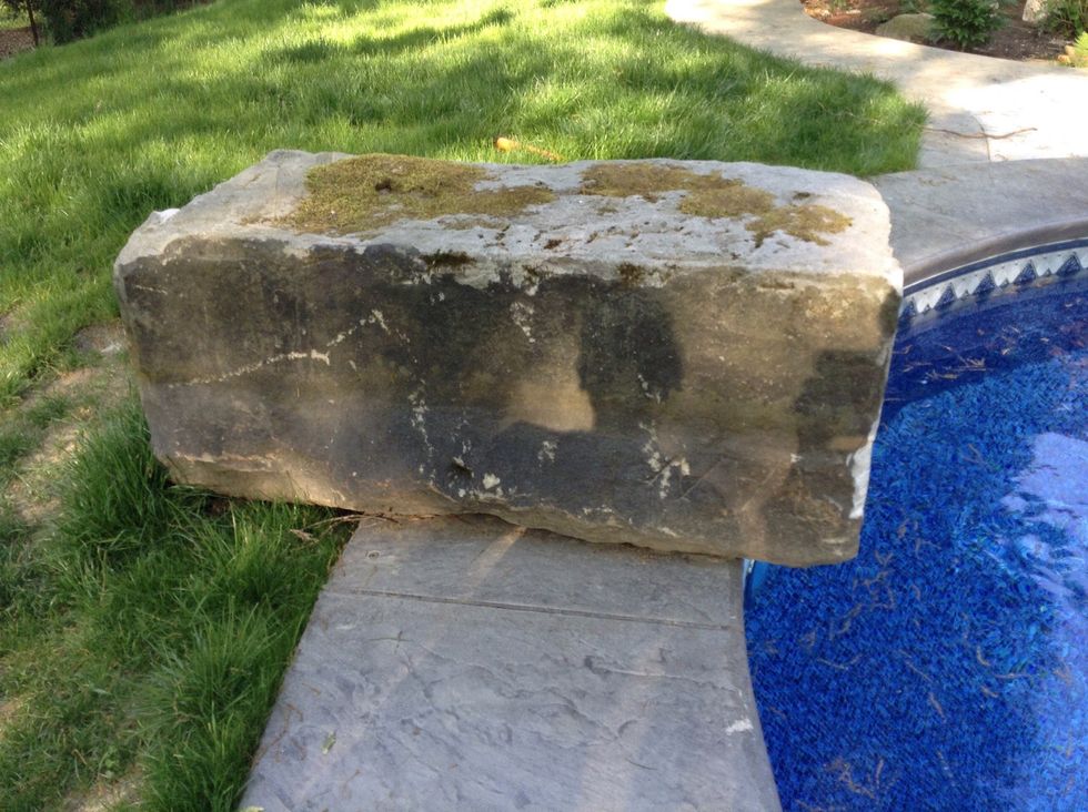 This is a big rock. We found it next to my pool. There is lots of chips in it and gravity probably weathered it away and exposed minerals