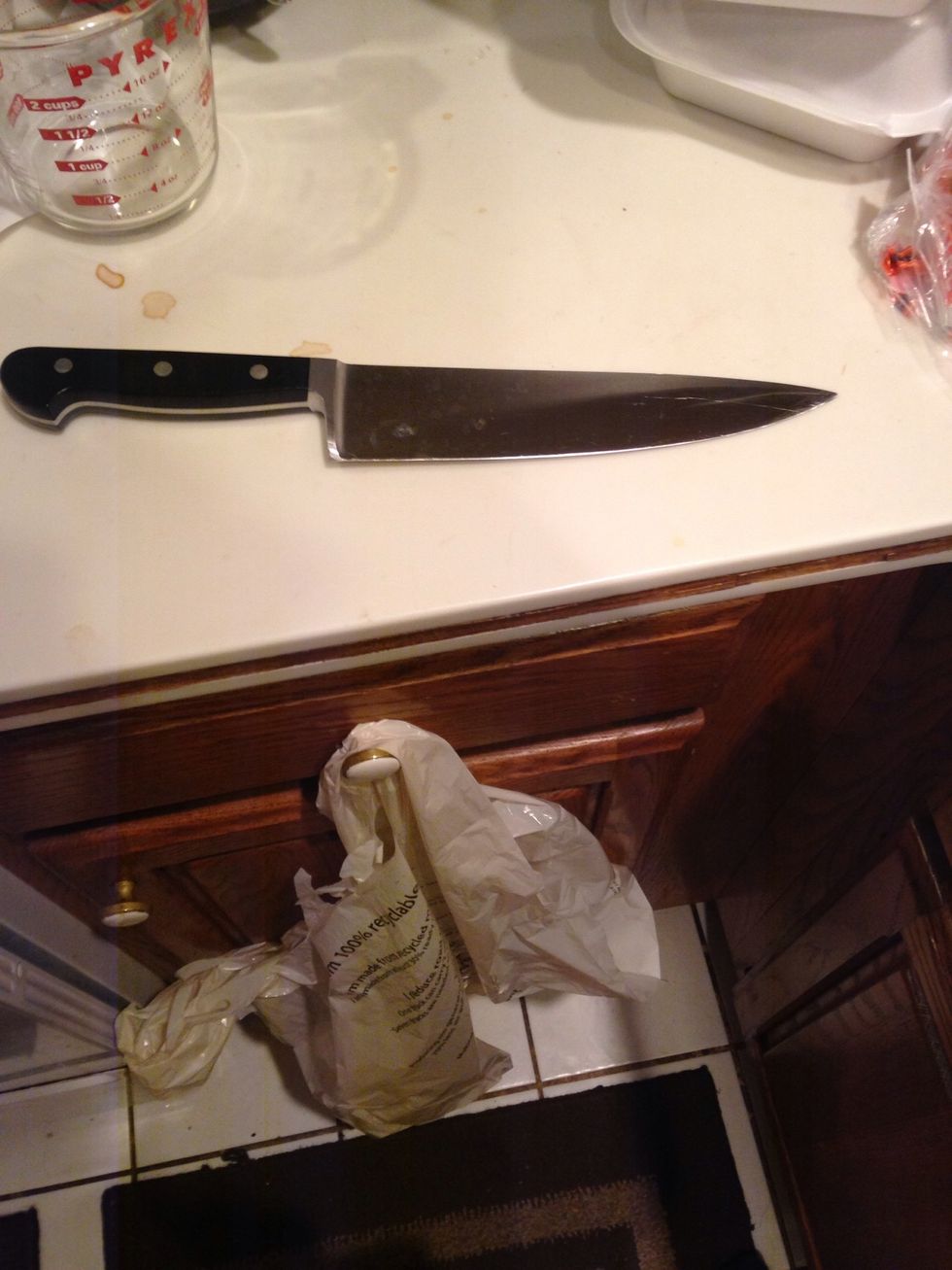 This is a chef's knife which is a cutting tool used in food preparation. I can use this to slice watermelon.