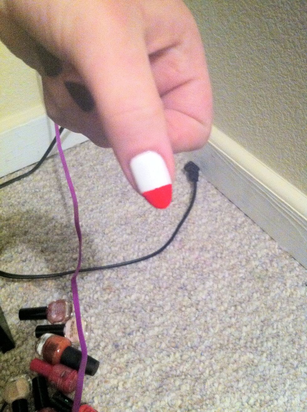 This is a close-up to show how much of your nail needs to remain white and how much needs to be painted red. There's more white then red.