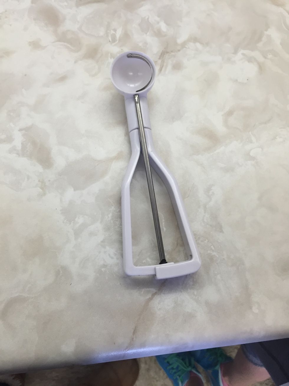 This is a cookie scoop it is used to scoop cookie dough into a ball. I can use a cookie scoop to scoop dough into a ball.