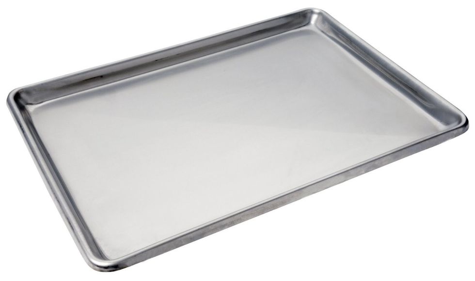 This is a cookie sheet is a flat metal tray used for baking cookies