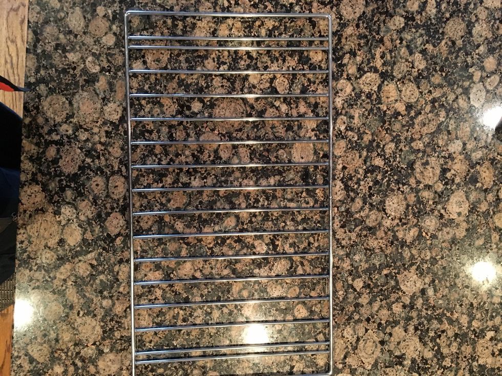 This is a cooling rack it is used to cool things such as cookies after they come out of the oven