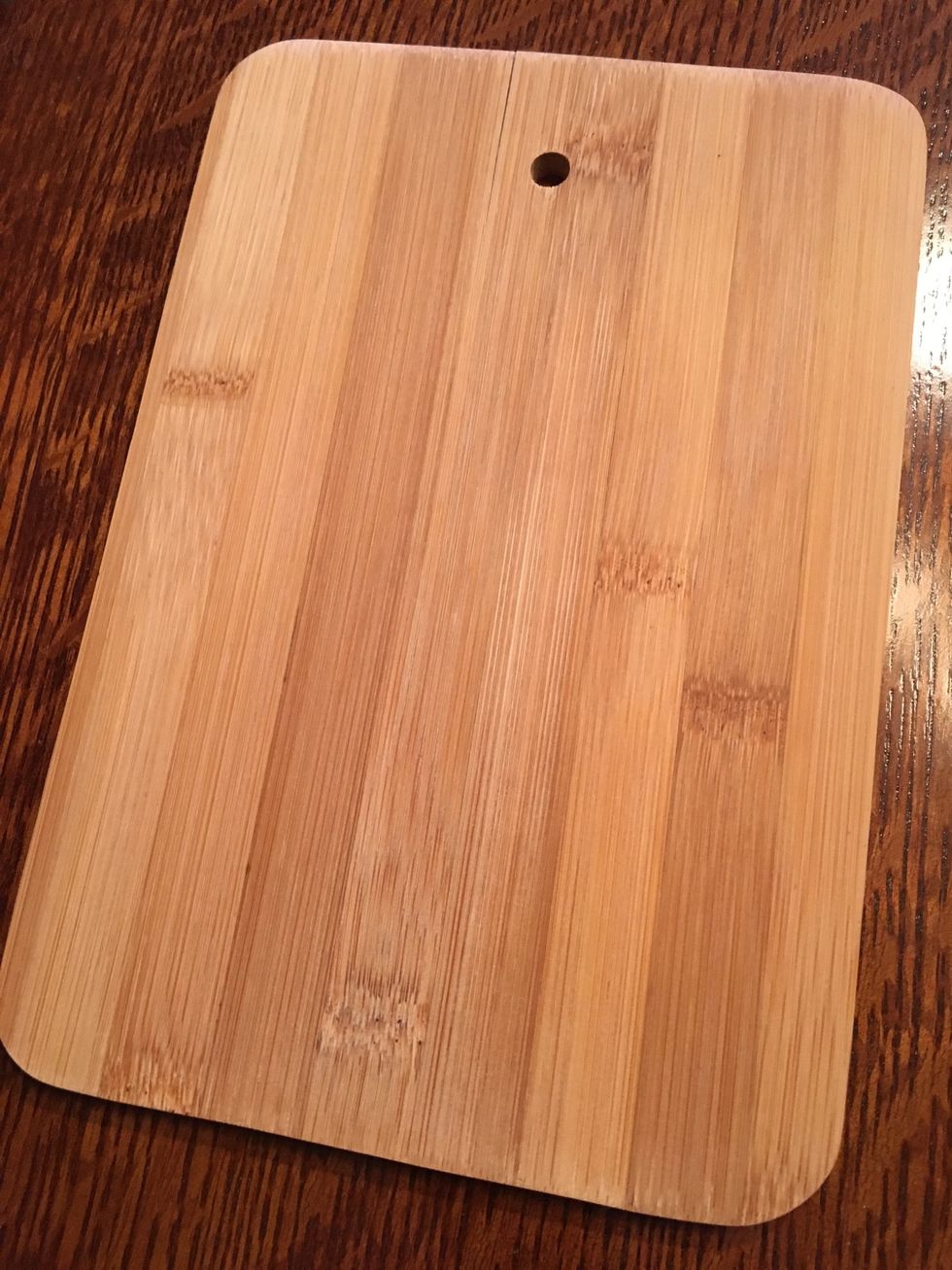 This is a cutting board it is used to cut meats fruits and vegetables on