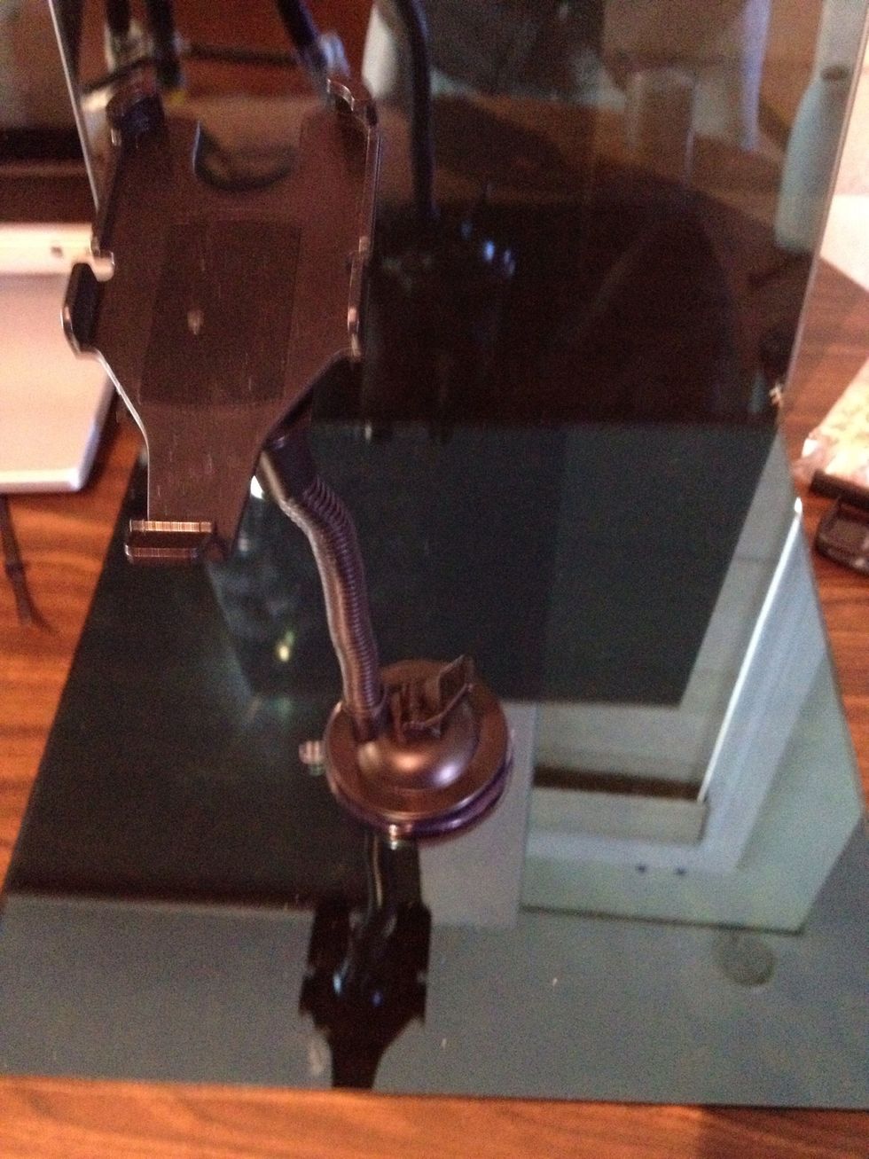 This is a flexible arm one with a suction cup get them of eBay