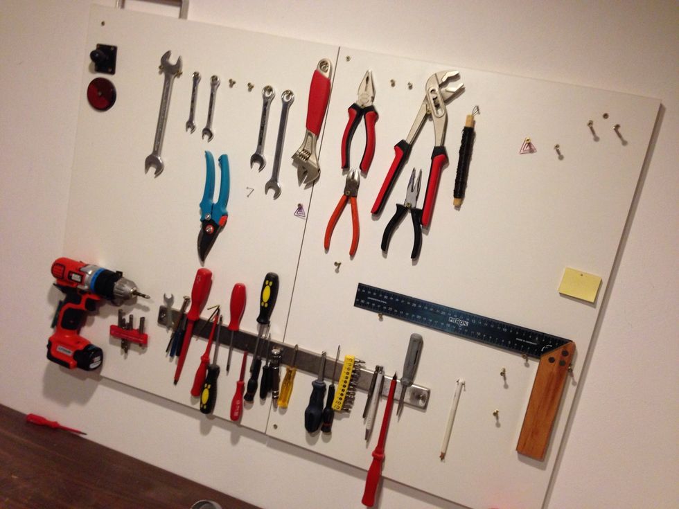 This is a fun part: Take some plywood, lay it on the table. Lay out some tools and create mounts with screws & nails. Now put the plywood on the wall. From now on you'll have all your tools at hand.