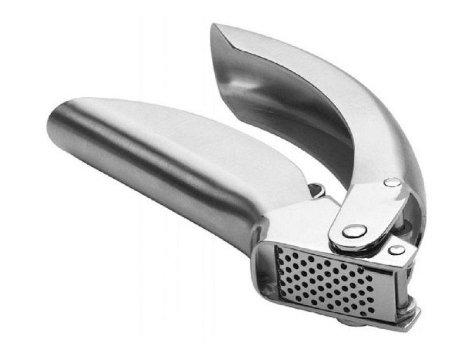 This is a garlic press you use it to make garlic into smaller pieces I can use a garlic press when I need to have smaller pieces of garlic for food