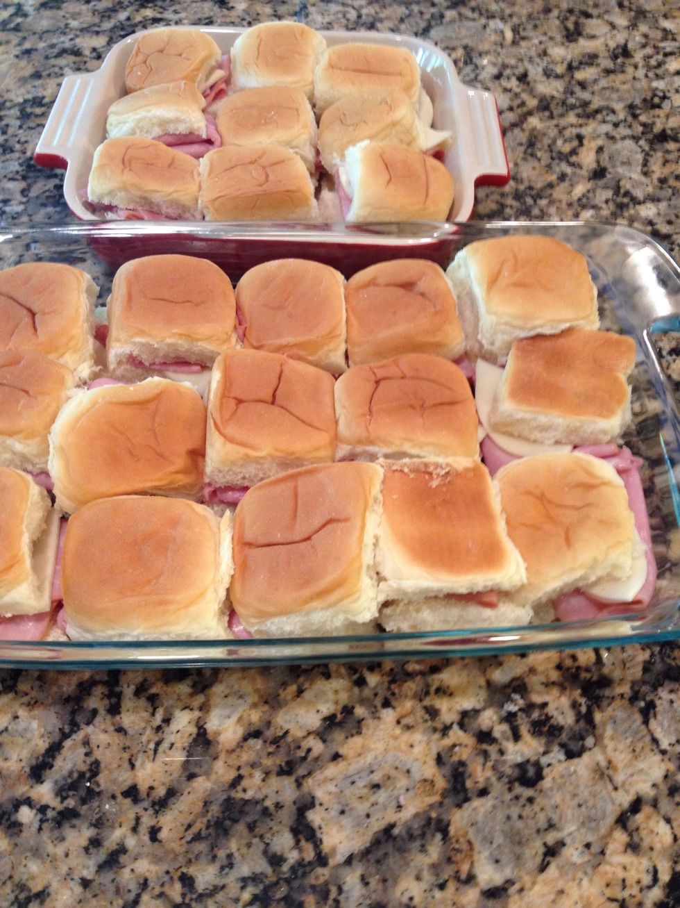 This is a great thing to do w a lot of kids. They make a little assembly line and stack sandwiches for me. Place in casserole dish. Squeeze them all in!