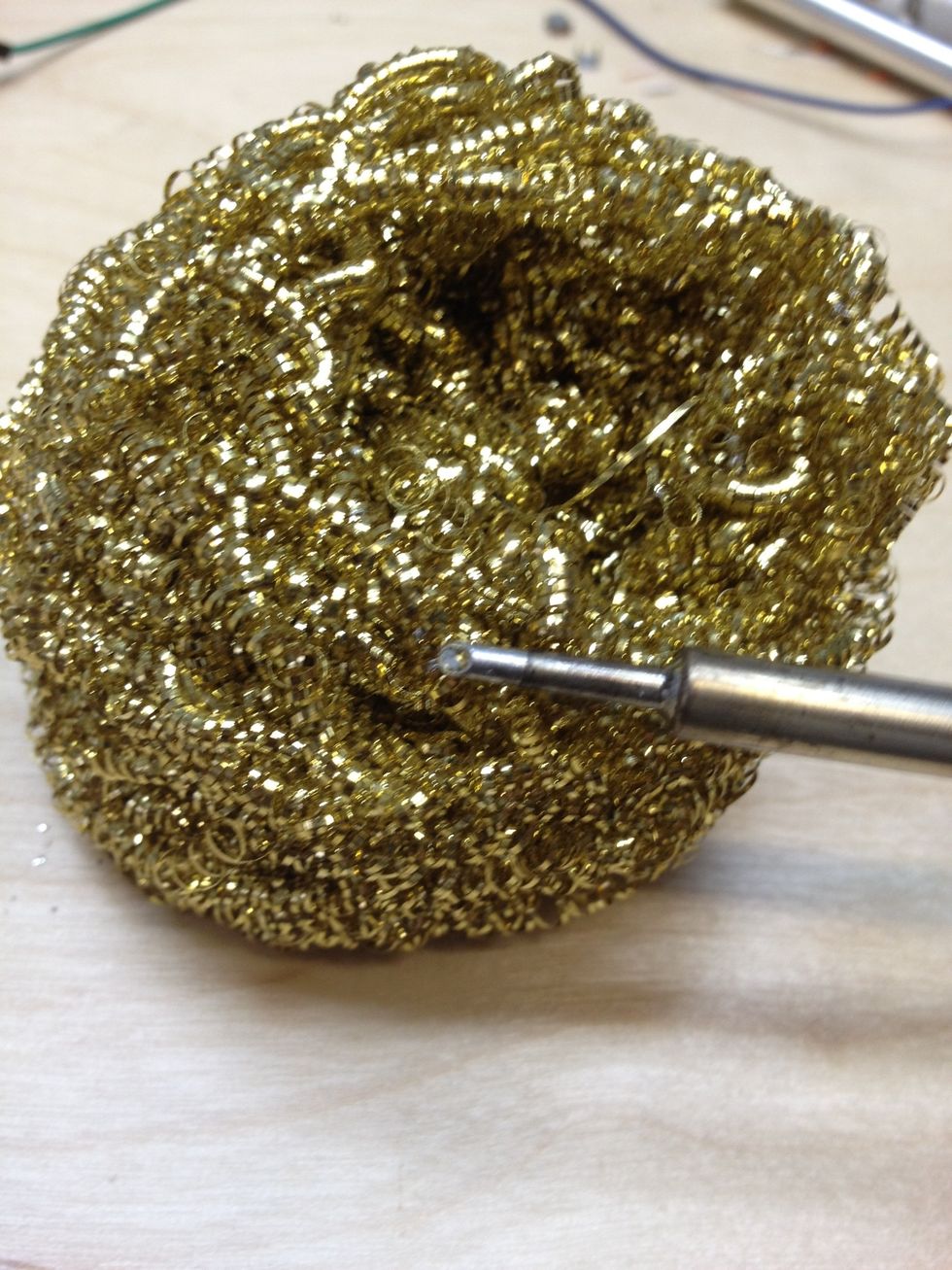 This is a gullwing tip, cleaned and ready to be tinned. Notice the dimple which will hold a pocket of solder and makes soldering fine pitch high pin count ICs quite easy. (chisel tips work too!)