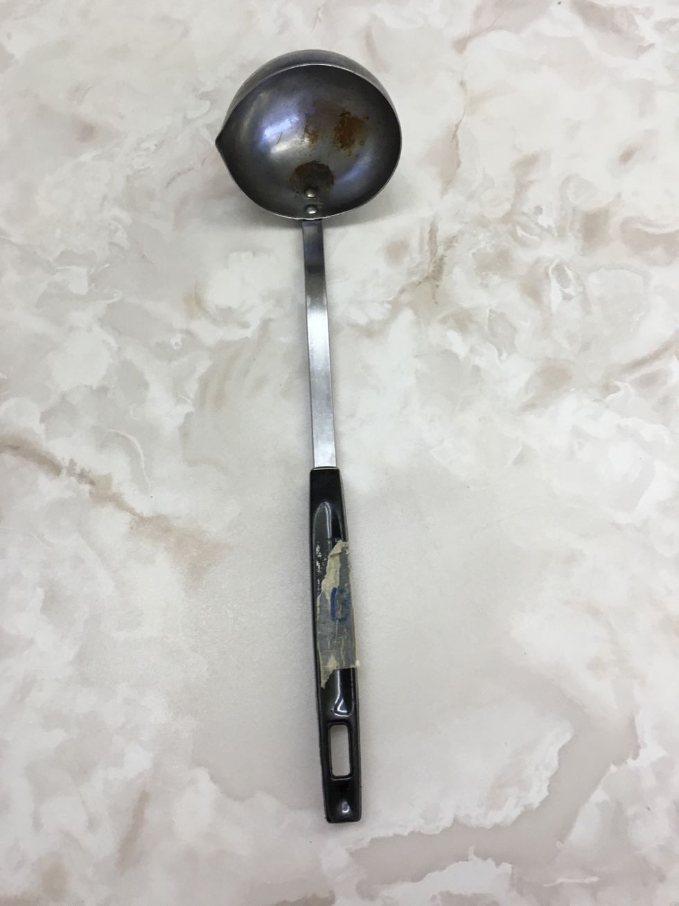 This is a ladle it is used to pick up liquids such as soup
