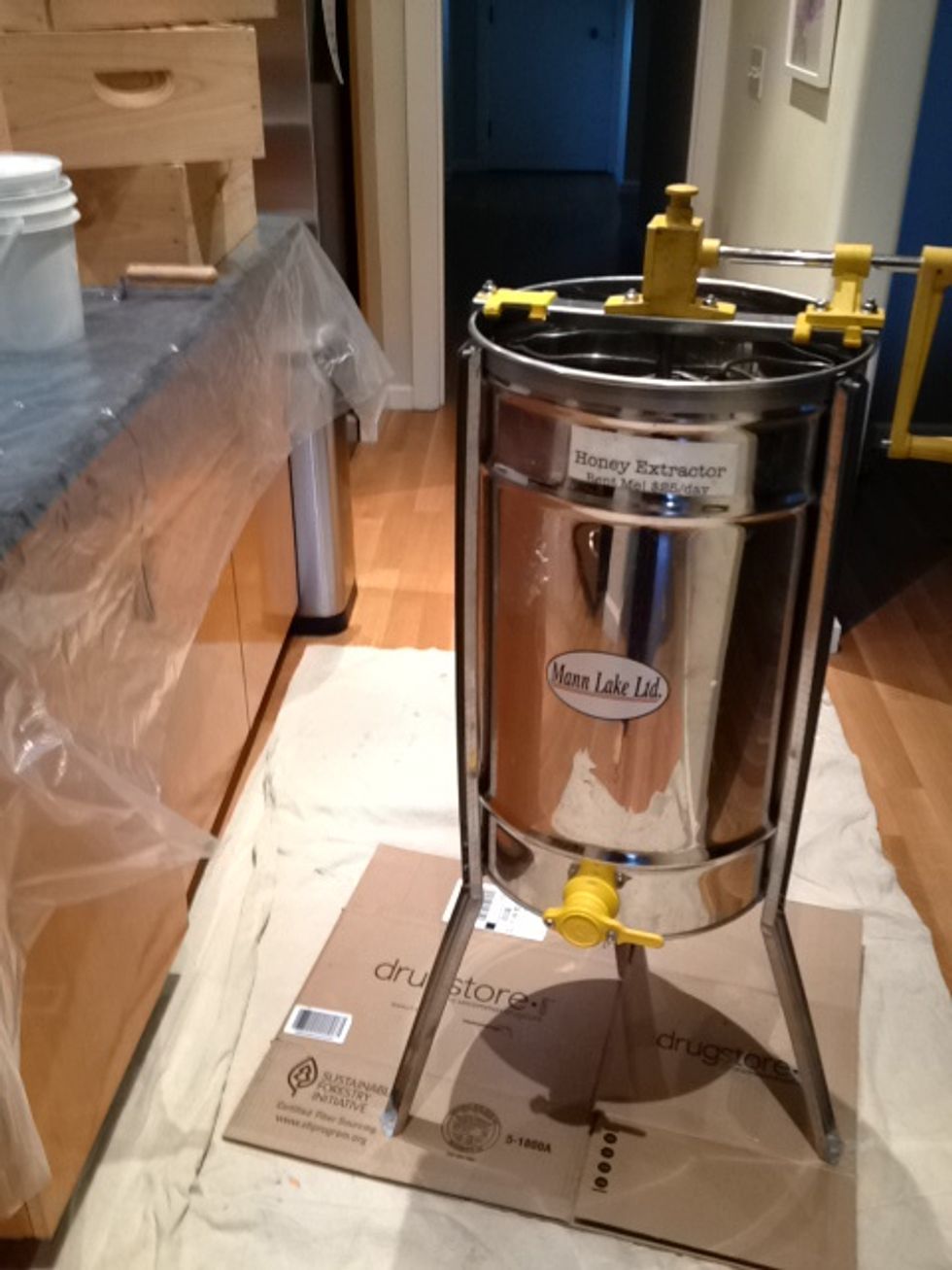 This is a manual 3-frame extractor. To protect the floors and countertops, I like to put down drop cloths and plastic sheets. This also makes it easier to clean up when you are finished.