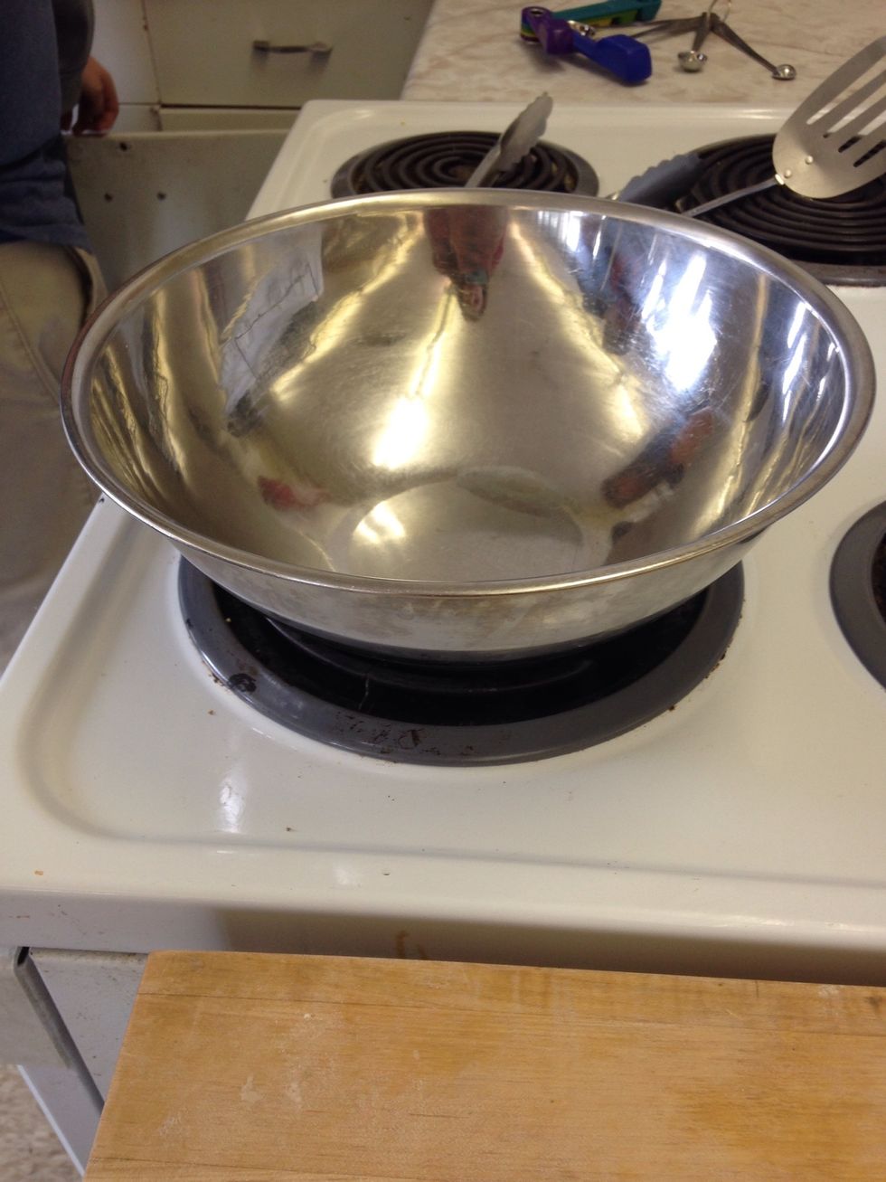 This is a metal mixing bowl. It is used for mixing ingredients. I can use it when I'm mixing things together.