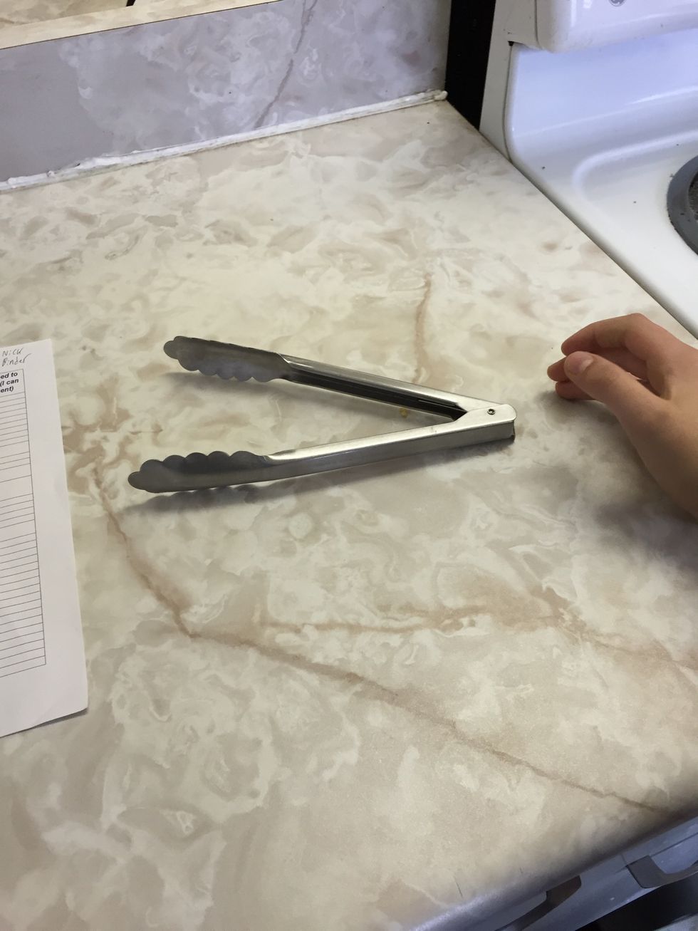 This is a pair of tongs. Tongs are used for picking food up. I can use tongs when I cook on the grill.