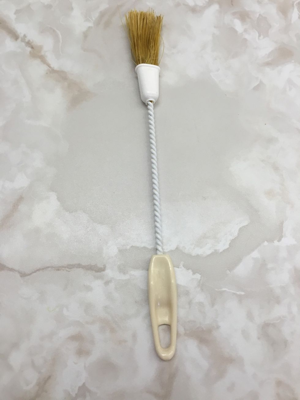 This is a pastry brush it can be used to brush her butter over pie crust dough