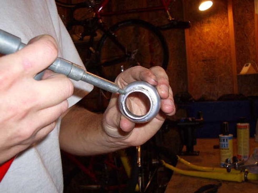 This is a picture of someone greasing the cups.