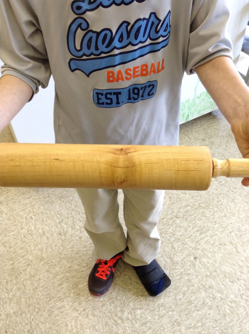 This is a rolling pin. It is used to flatten dough. I can use a rolling pin to flatten the dough for bread.