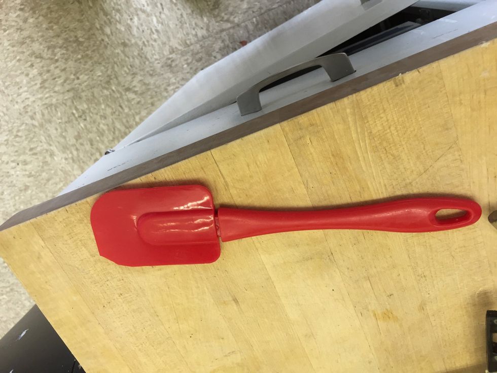 This is a rubber scraper. It is used for scraping stuff and getting hard to reach stuff. I can use it to wipe food off the inside of a bowl.