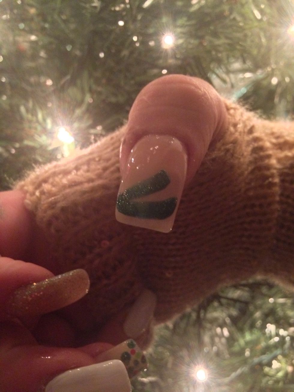 This is a simple tree. Take your polish brush and make a stripe as so.