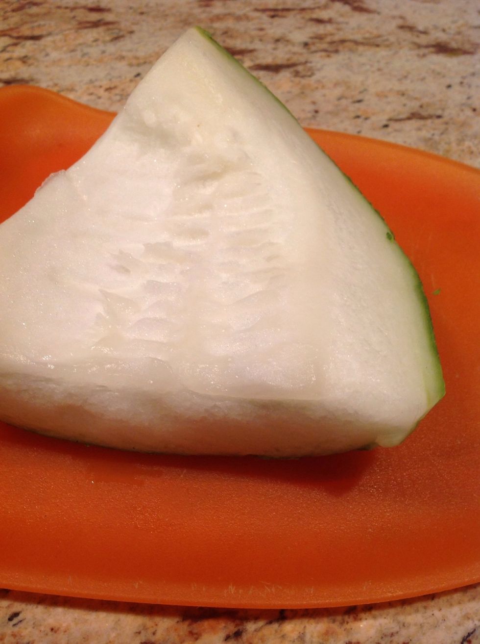 This is a slice of winter melon, cleaned off its seeds.