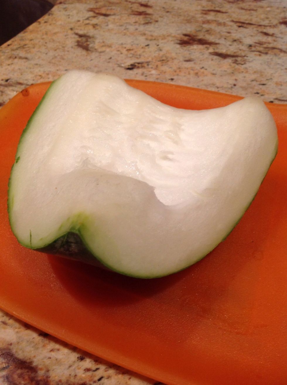 This is a slice of winter melon, cleaned off its seeds.