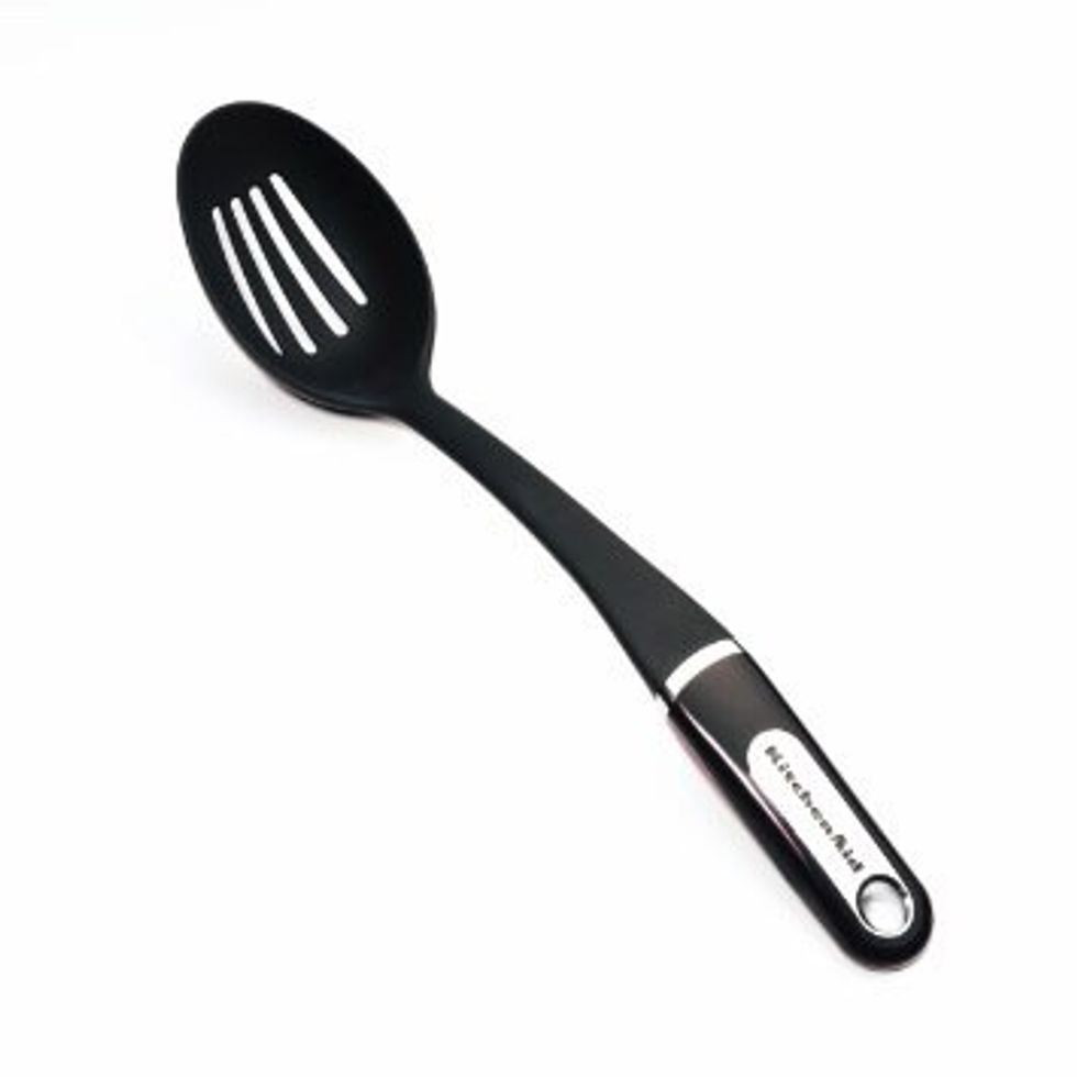 This is a slotted spoon it is used to remove food from liquid while it's being cooked I can use it when I boil noodles
