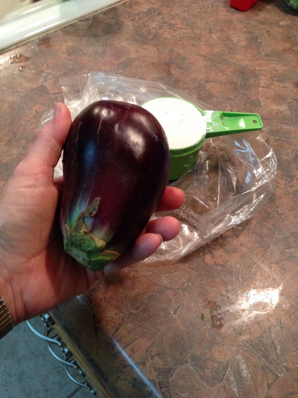 This is a small Eggplant from our garden. I get everything ready before I peel it as they tend to change color quickly once peeled.