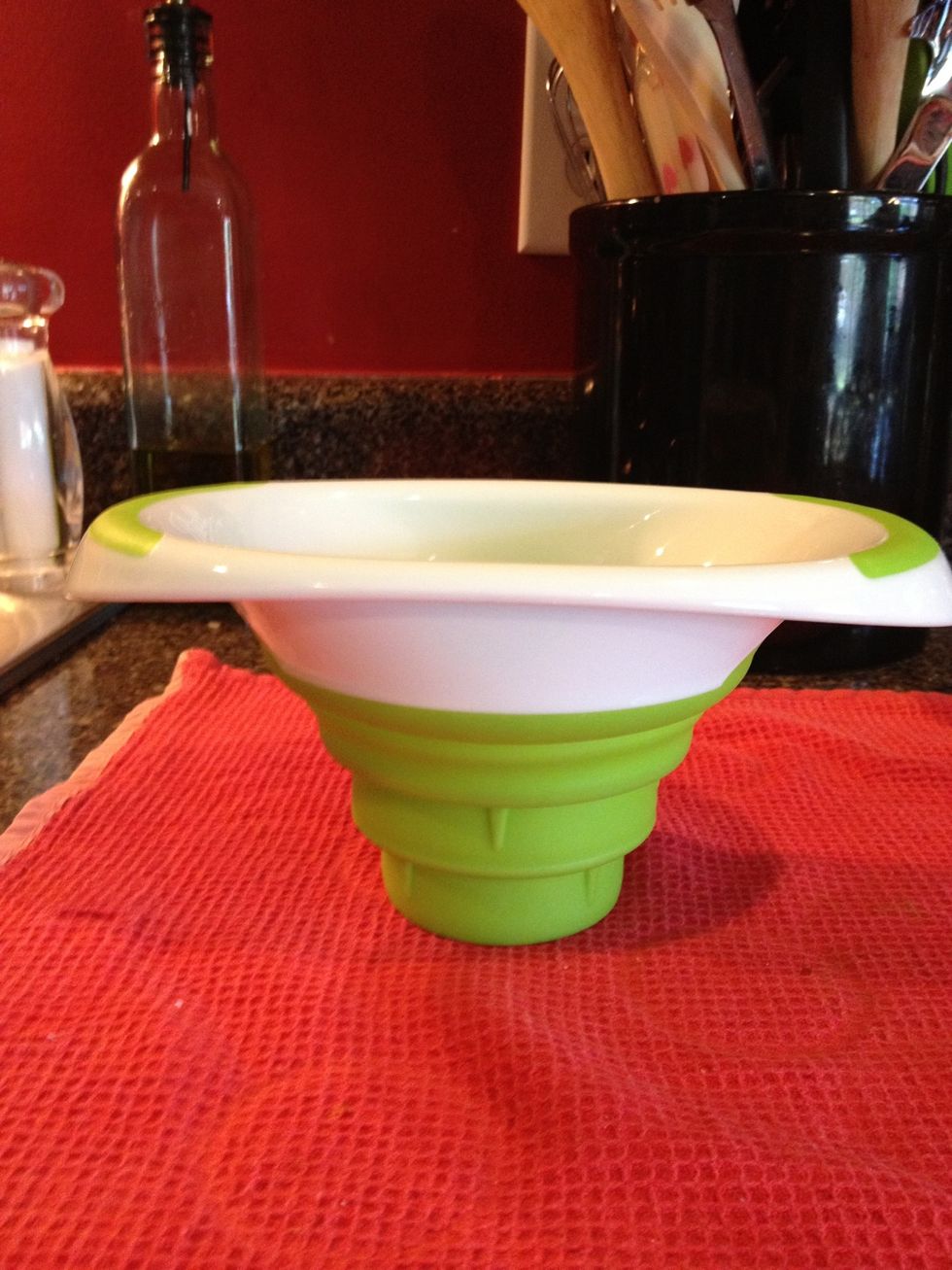 This is a special funnel designed to fit in the wide mouths of Mason jars. It's adjustable to fit the various sizes of these jars. I picked mine up at the grocery store.