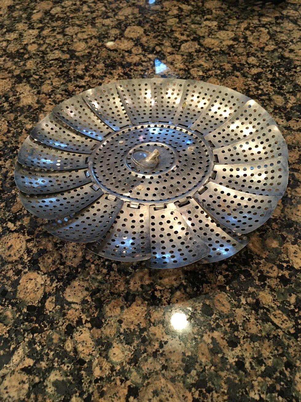 This is a steamer basket it is used to steam vegetables stove top