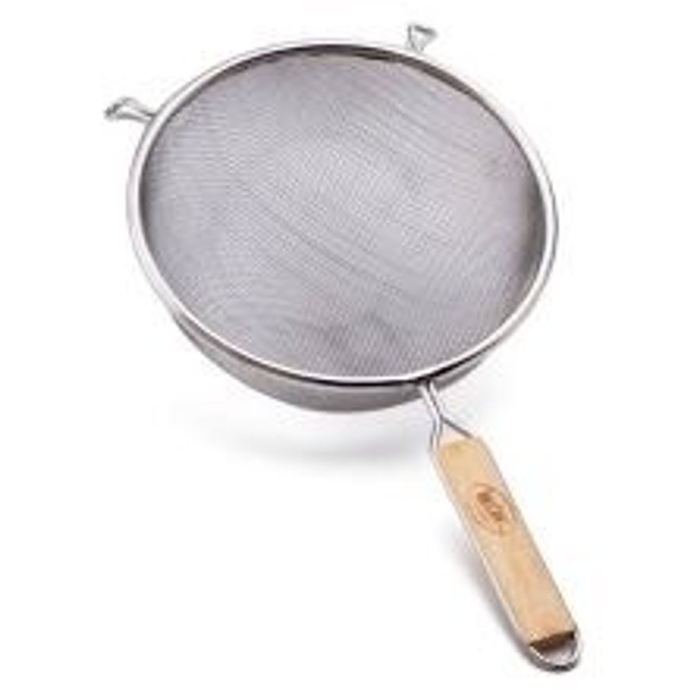 This is a strainer. It used to separate the solids from the liquids. I can use a strainer when I cook something fried and I need to get the grease out of the food.