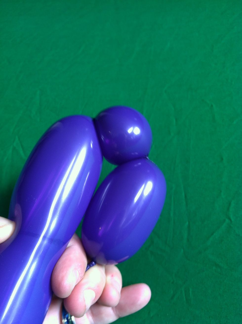 This is a three bubble string, and the beginning of a pinch twist