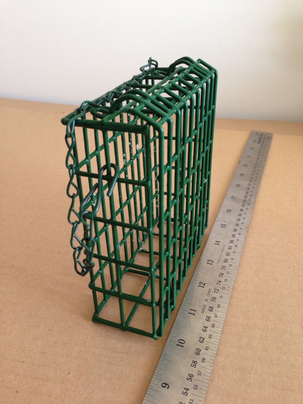 This is a typical suet cage. Measure the maximum interior dimensions, which this cage is 4 1/2" wide x 4 5/8" height x 1.5" deep.