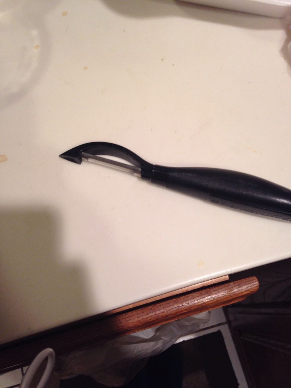 This is a vegetable peeler. It can be used to peel vegetables and fruits. I can use this to peel a potatoe.