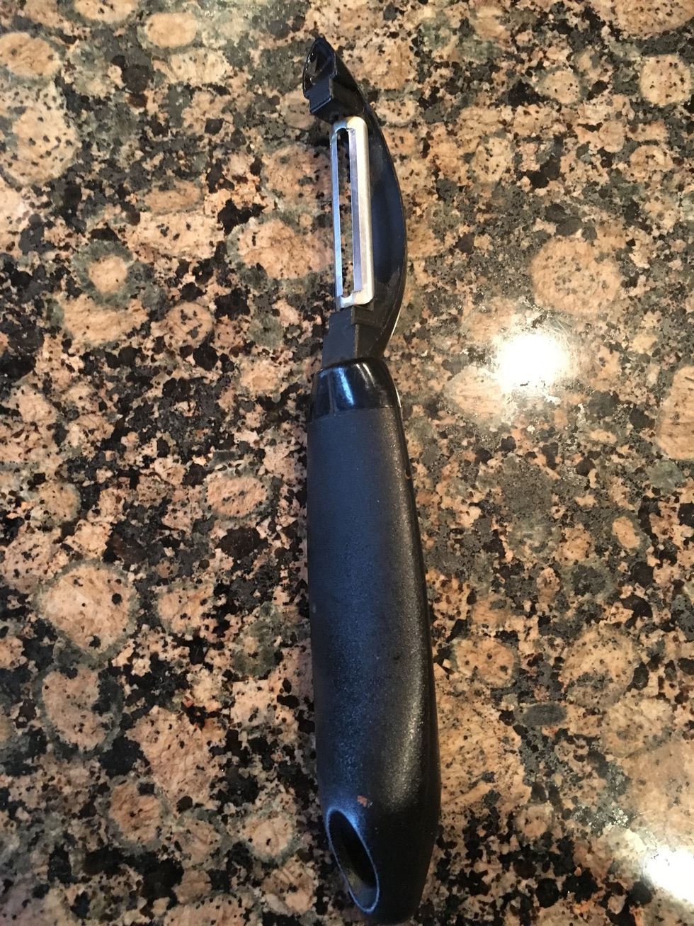 This is a vegetable peeler it is used to peel the skin off vegetables