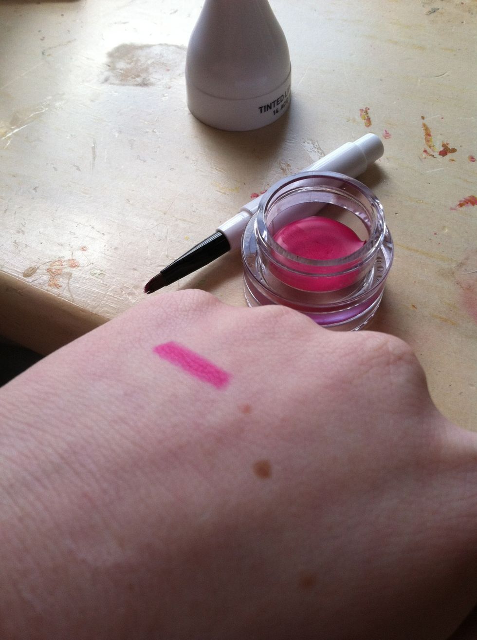 This is a very bright and pigmented pink shade that's perfect for summer! I love the packaging of this, because it comes with a brush in the handle. It is a little bulky, but I like the product!