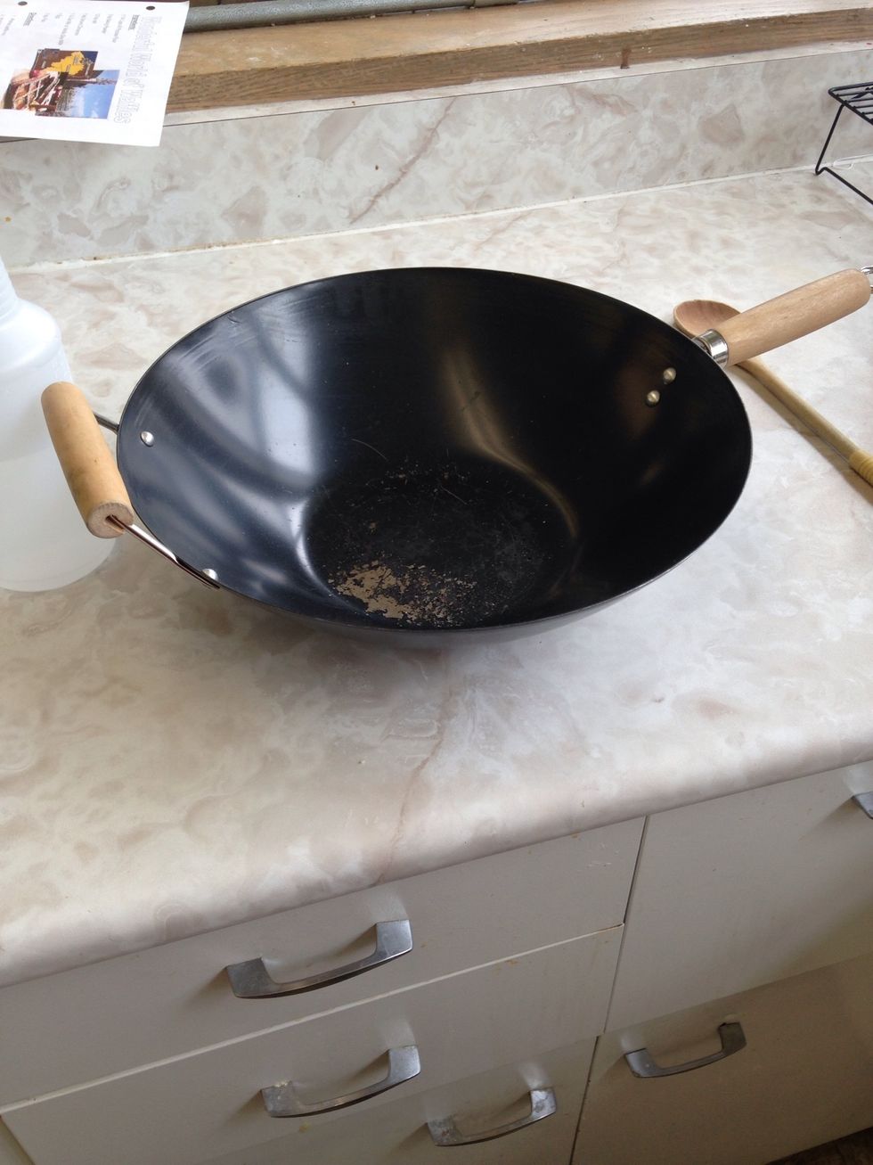 This is a wok. A wok is used in a range of different Chinese cooking techniques. I can cook stir fry with a wok.