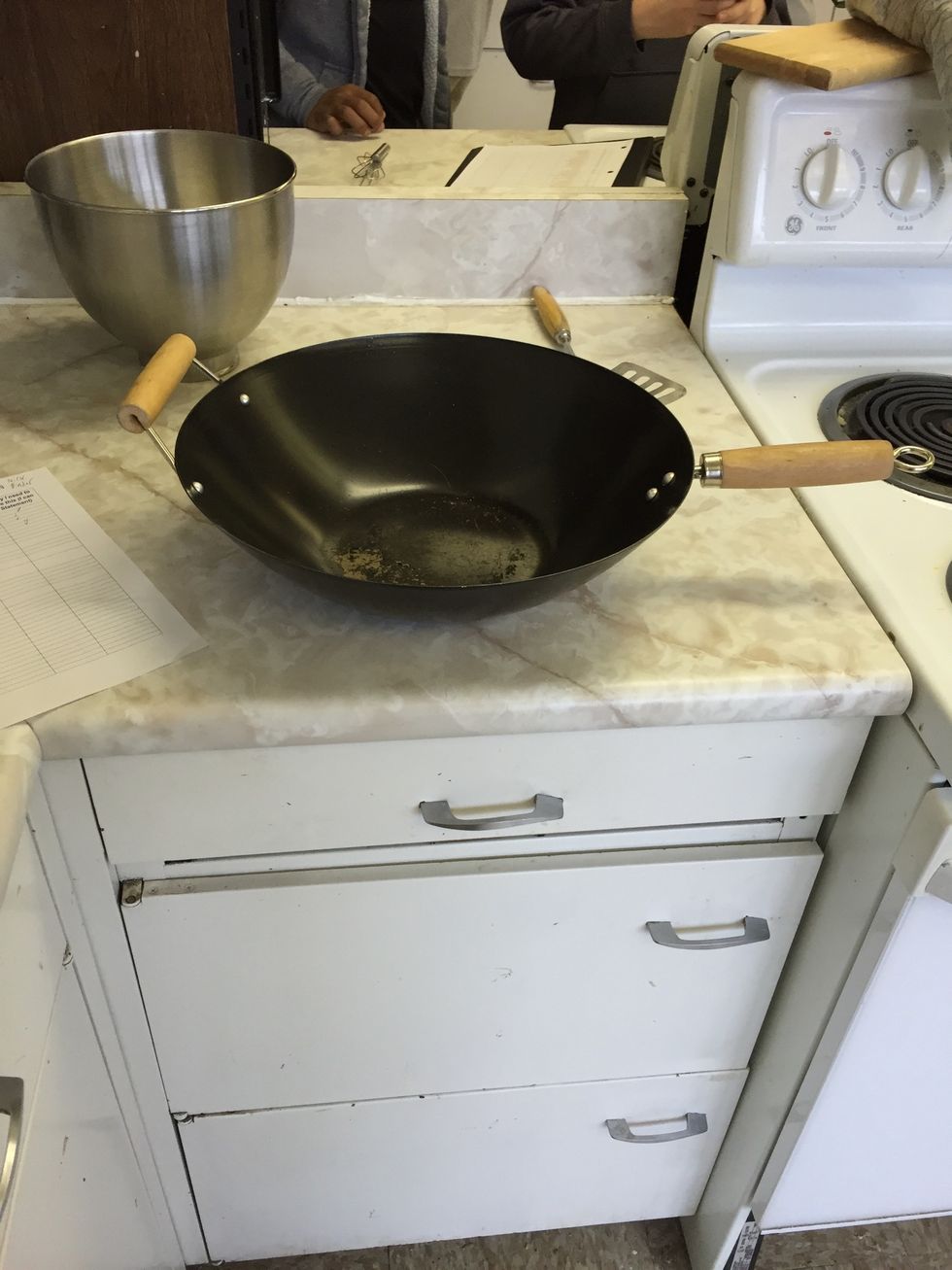This is a wok. It's use is putting food in it and cooking it and it usually makes Asian food. I can use a wok when I cook stir fry.
