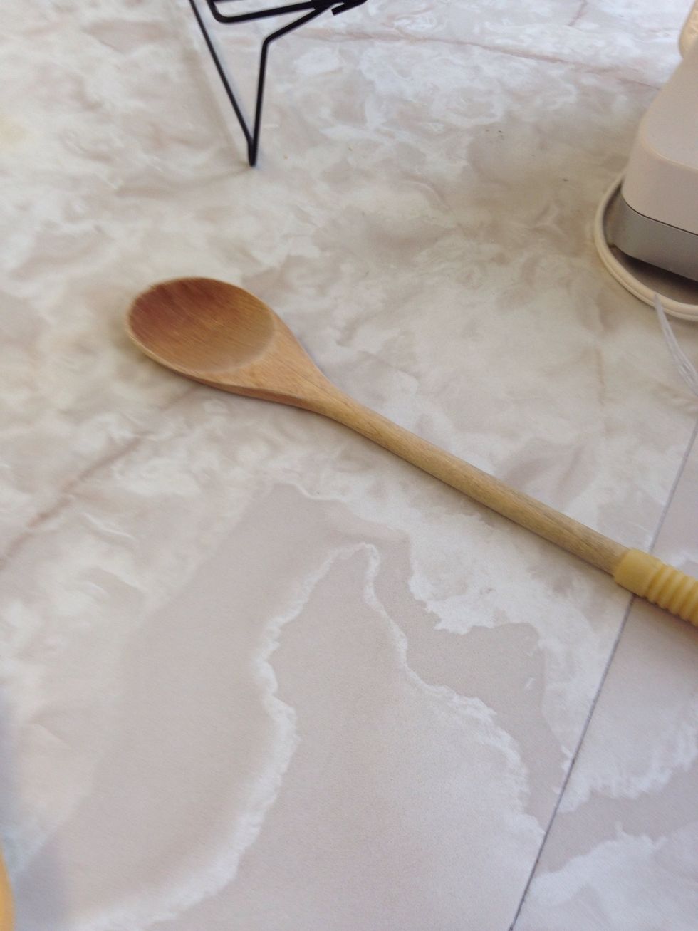 This is a wooden spoon. It can be used to transfer heat unlike a metal spoon. I can use this to mix ingredients.