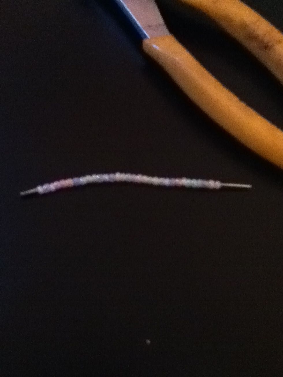 This is about the size of the wire you need left when you cut the remainder off. About two centimeters, if you feel comfortable folding that amount of wire in half.