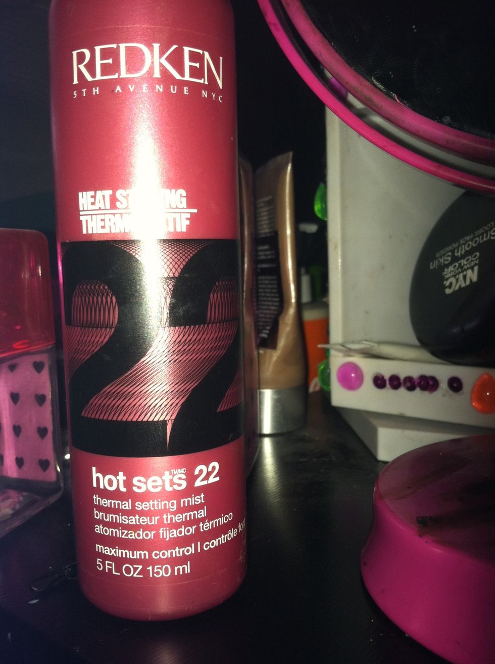This is an additonal step that only needs to be taken if you own a similar product. Apply a heat styling hair spray. This will make your hair stay straight without feeling crusty and sticky.
