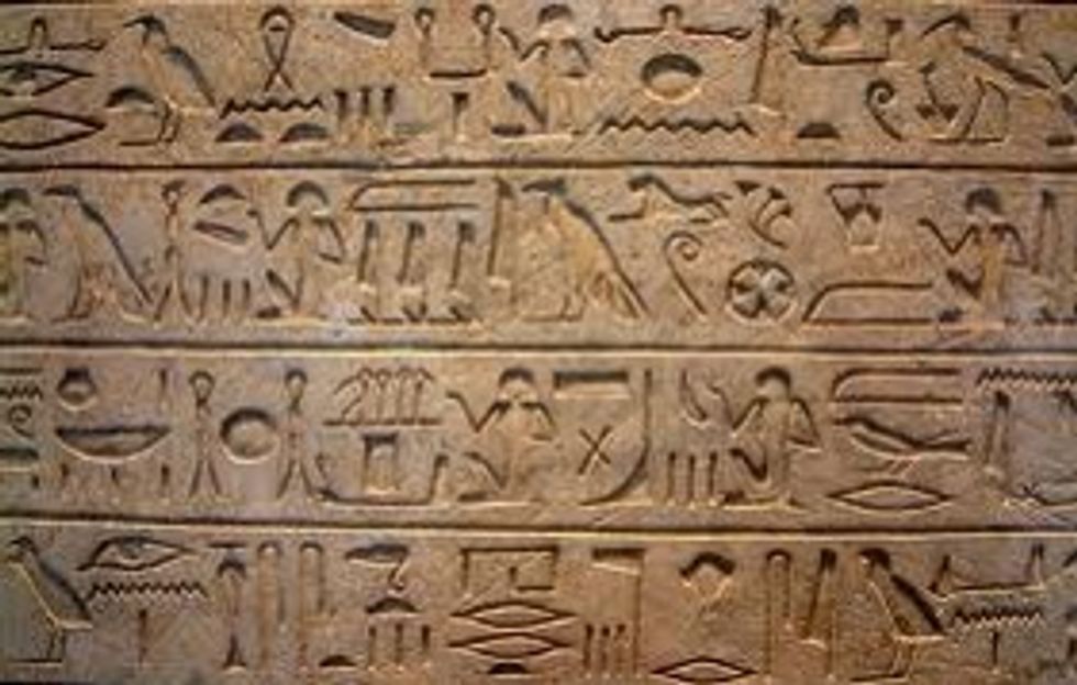 This is an ancient mud tablet with hieroglyphics
